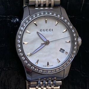 Gucci timeless watch with 42 diamonds all around!